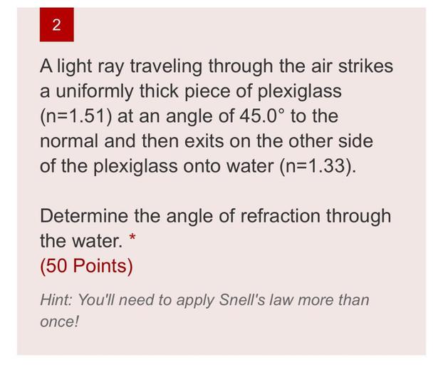 2 A light ray traveling through the air strikes a un... Physics